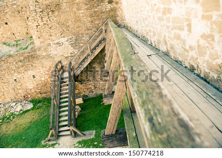 old wooden path with ladders at vintage castle