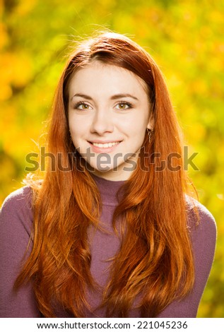 smiling redhead woman fall season portrait