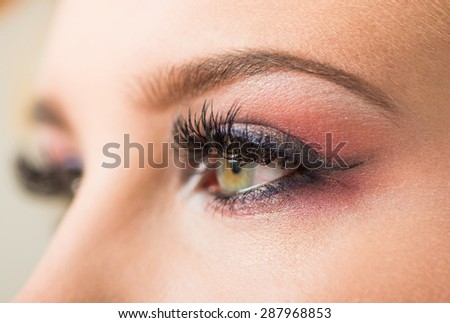 young woman open eye from the side view