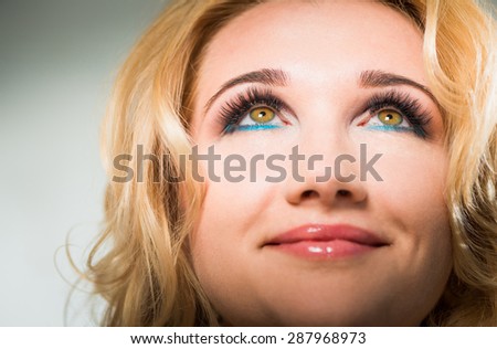 smiling blond woman portrait with open eyes