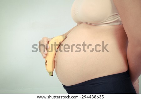 pregnant woman and bananas vintage color