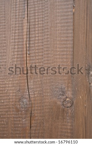 texture of dark lacquered wood with cracks and knots