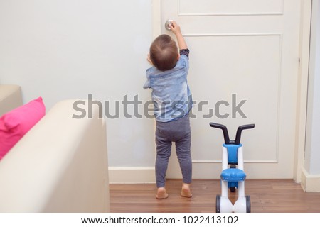 Similar – Image, Stock Photo Baby reaching for feet, dimpled baby hands, triangle print blanket and pants