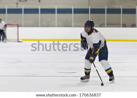 Woman ice hockey player during a game