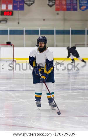 Female ice hockey athlete during a pre-game warm-up