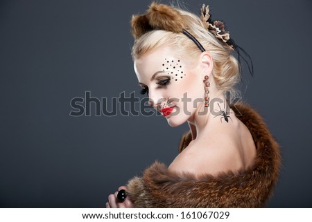 Halloween, a beautiful girl in a mask fox