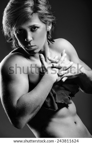 Powerlifting woman portrait with crossed tended hands. Black and white version.