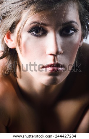 Short haired woman close up portrait with sad face