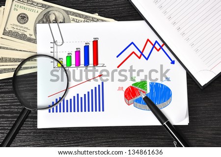 paper with chart and money in the office