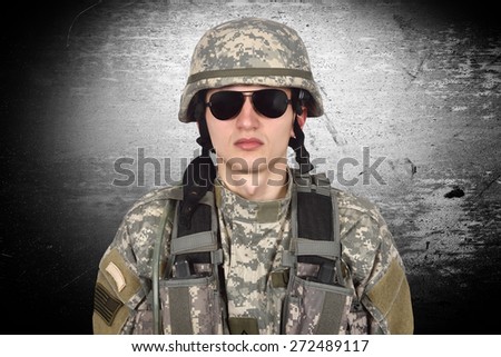 young american soldier on a gray background