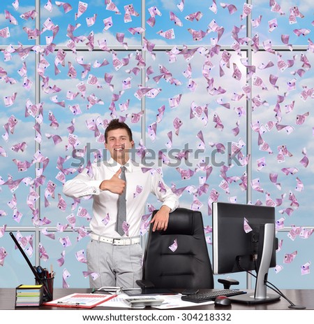 businessman showing thumb up and falling euro banknote