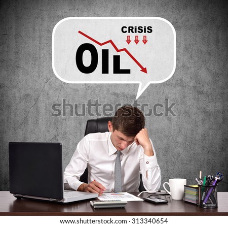 Tired businessman thinking about the fall in oil prices