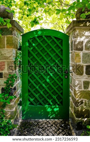 Similar – Image, Stock Photo old closed garden gate with wire mesh fence and hole