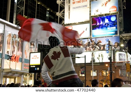 TORONTO - FEB 28: Fan celebrates after Canada wins a gold medal in Olympic Men\'s Hockey February 28, 2010 in Toronto, Ontario, Canada