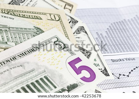 Background of american dollar bills of several values and business background.