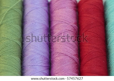 spools of many colors of thread and textiles