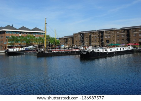 CANARY WHARF, LONDON-JULY 16: Traditional house boats at West India Quay (North Dock) in Canary Wharf on July 16, 2006. The dock was one of three docks on the London\'s Isle of Dogs and opened in 1802.