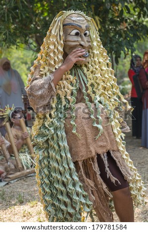 CAREY ISLAND, SELANGOR,MALAYSIA - MARCH 1, 2014 : Unidentified man of Mah Meri tribe dances during the Ari Moyang (Ancestors Day) celebration in Pulau Carey Island, Klang, Malaysia.