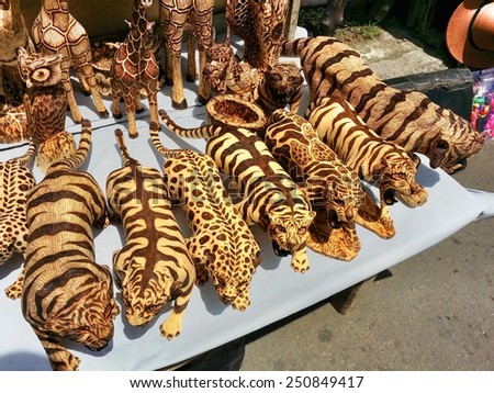 TANGKUBAN PERAHU, BANDUNG, WEST JAVA, INDONESIA - SEPTEMBER 15, 2014: Wooden animal toy miniatures on sale in Tangkuban Perahu, Indonesia. These wooden toys are made from special batik wood.