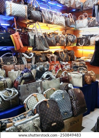 BANDUNG, WEST JAVA ISLAND, INDONESIA -SEPTEMBER 16, 2014: Large collection of famous fake handbags on display at one of the shopping centres in Bandung. The fake handbags are widely sold cheaply here.