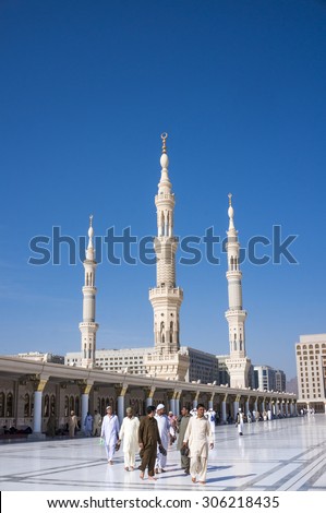 MEDINA, SAUDI ARABIA-DEC 19, 2014 : Exterior view of Muslims after prayer in Medina, Saudi Arabia. This is second holies mosque in Islam.