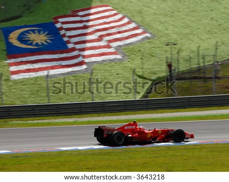 Kimi Raikkonen on a straight line in front of Malaysian flag at Sepang F1 Malaysia 2007 Grand Prix