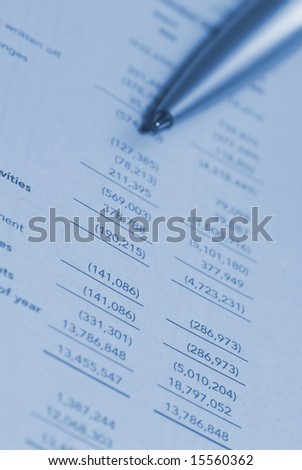 Ballpoint pen on financial statement figures
