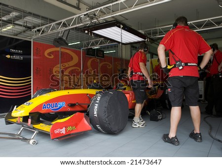 SEPANG, MALAYSIA - NOVEMBER 22 :  A1 Team China pit crews take a break at A1GP World Cup of Motorsport in Sepang, Malaysia November 22, 2008.