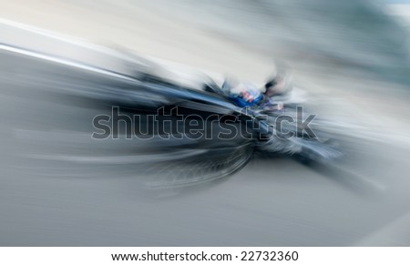 Motion blur of sports car at motorsports championship race.