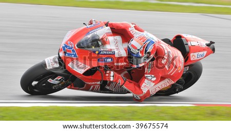 SEPANG, MALAYSIA - OCT 25 : Australian Casey Stoner of Ducati Marlboro Team negotiates a corner during warm up session at Shell Advance Malaysian Motorcycle Grand Prix on October 25, 2009 in Sepang.