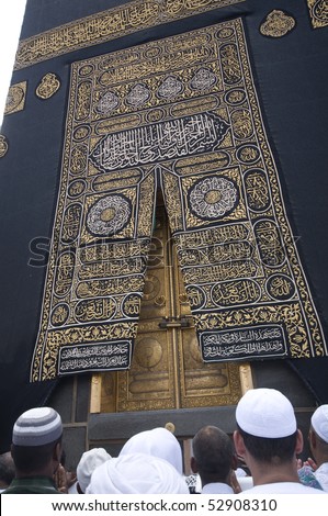 MAKKAH - APRIL 26 : A close up view of kaaba door and the kiswah (cloth that covers the kaaba) at Masjidil Haram on April 26, 2010 in Makkah, Saudi Arabia. The door is made of pure gold.