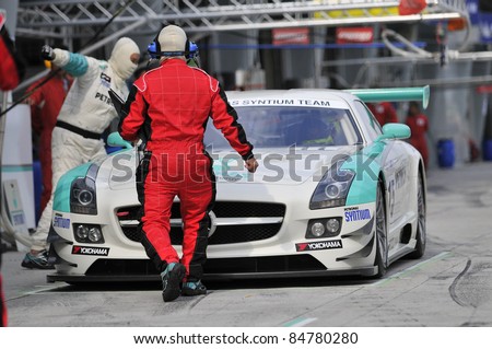 SEPANG, MALAYSIA-SEPT 16:PETRONAS Syntium Team driver in Mercedes SLS car at pitstop during GT Class qualifying session of Malaysia Merdeka Endurance Race (MMER) 2011 in Sepang, Malaysia on 16, 2011