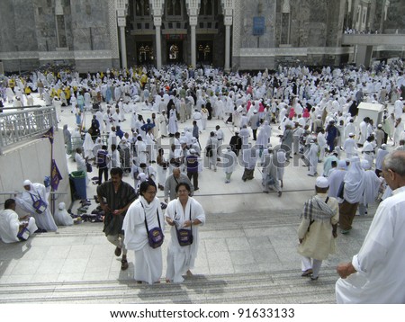 MECCA - DEC 5 :Muslim pilgrims in front of Haram Mosque entrance on Dec 5, 2007 in Mecca, Saudi Arabia. Millions of muslims around the world come for hajj during this time.