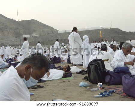 MUZDALIFAH, SAUDI ARABIA - DEC 19 :Muslim pilgrims take a rest at dawn on Dec 19, 2007 in Muzdalifah, S. Arabia. Millions of muslims around the world perform hajj during this time.