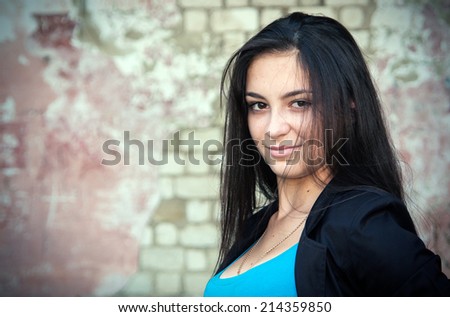 Young beautiful brunette girl with a sweet smile