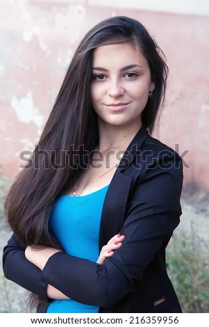 Young beautiful brunette girl with a sweet smile