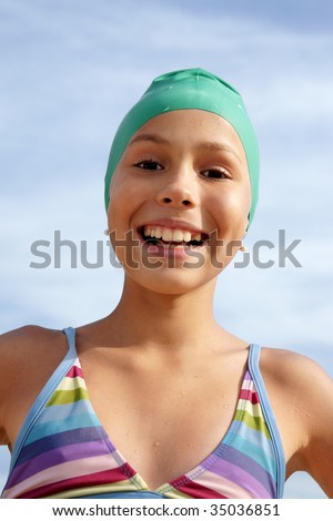Preteen girl enjoying sun-bath on sea beach