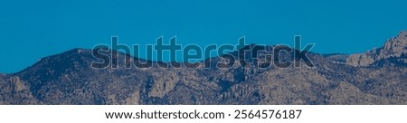 Similar – Foto Bild ein Gebirgszug, umrahmt von Vegetation an den Rändern, an einem Sommertag mit einem Himmel mit baumwollartigen Wolken, Pena Telera, Valle de Tena, Biescas, Huesca, Spanien