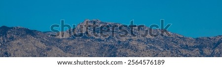 Similar – Foto Bild ein Gebirgszug, umrahmt von Vegetation an den Rändern, an einem Sommertag mit einem Himmel mit baumwollartigen Wolken, Pena Telera, Valle de Tena, Biescas, Huesca, Spanien