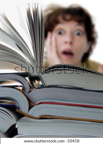 Terrified woman behind a big pile of books