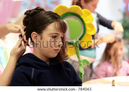 A girl getting her hair done