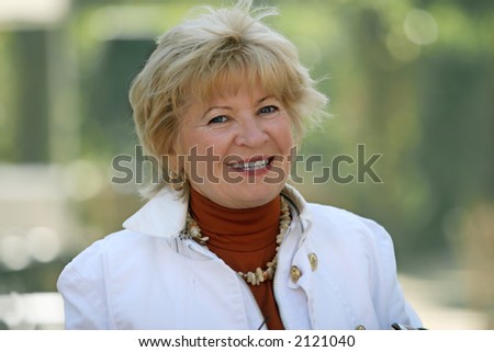 Outdoor portrait of a happy mature woman