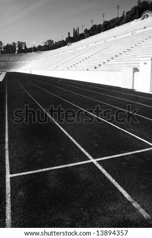 running tracks on the empty olymic stadium in athens, in black and white