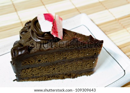 Chocolate truffle cake on white dish