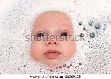 baby face in shampoo foam