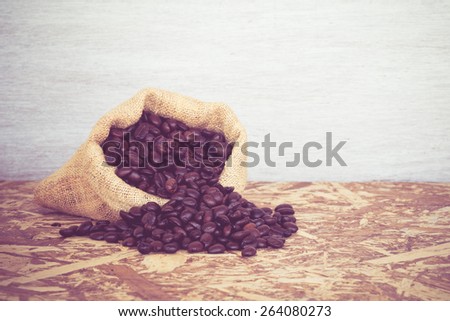 Coffee beans in a bag with filter effect retro vintage style