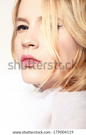 beautiful model with natural make up and blonde hair and pink lips
