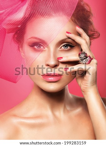 Beauty fashion model on cover magazine on pink background, jewerly