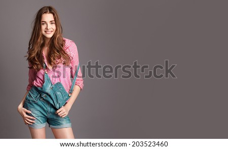 Fashion young  girl with curly shine hair