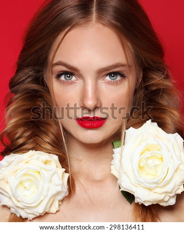Fresh young fashion model with red lips. Wedding make up. White roses.